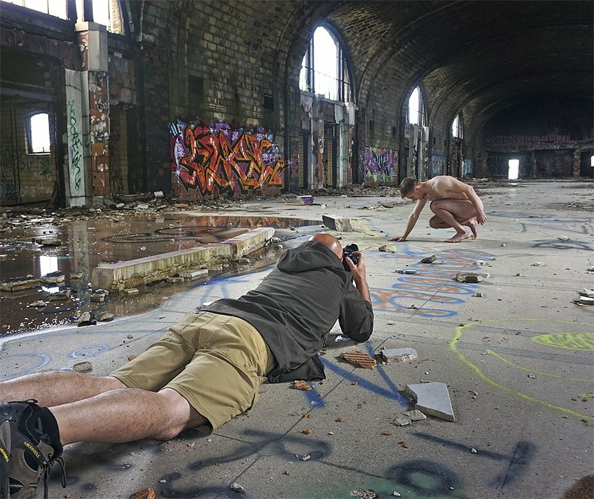 Photographer Rob Colgan shooting with nude model in abandoned building