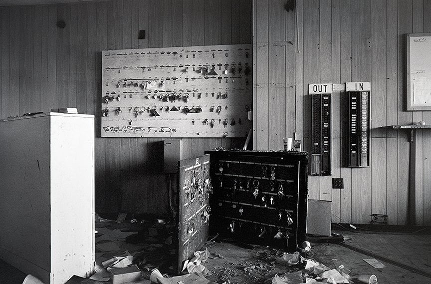 darkened room with panels containing keys for facility