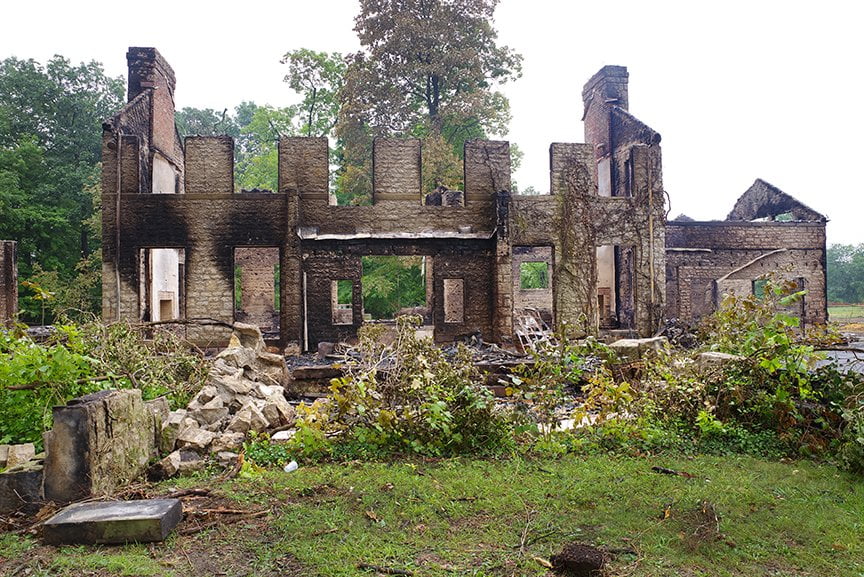 remains of house after it was set aflame for firemen's training