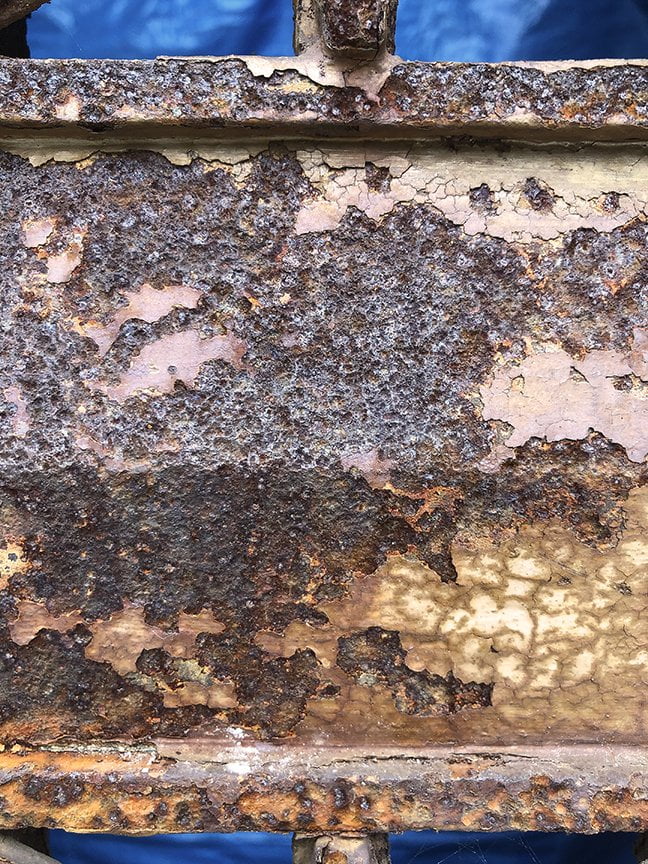 rusty surface showing bits of paint