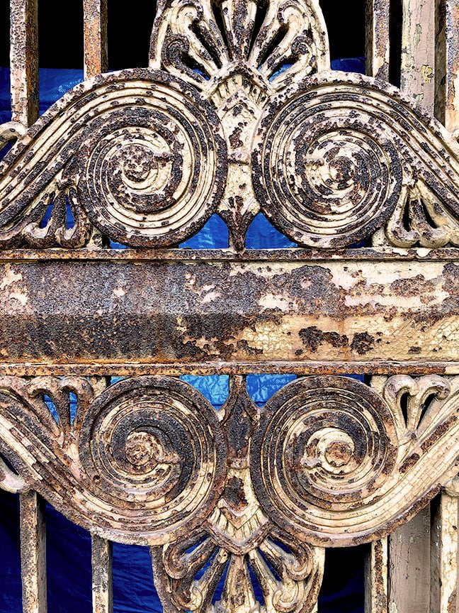 rusty painted detail of scrollwork in metal