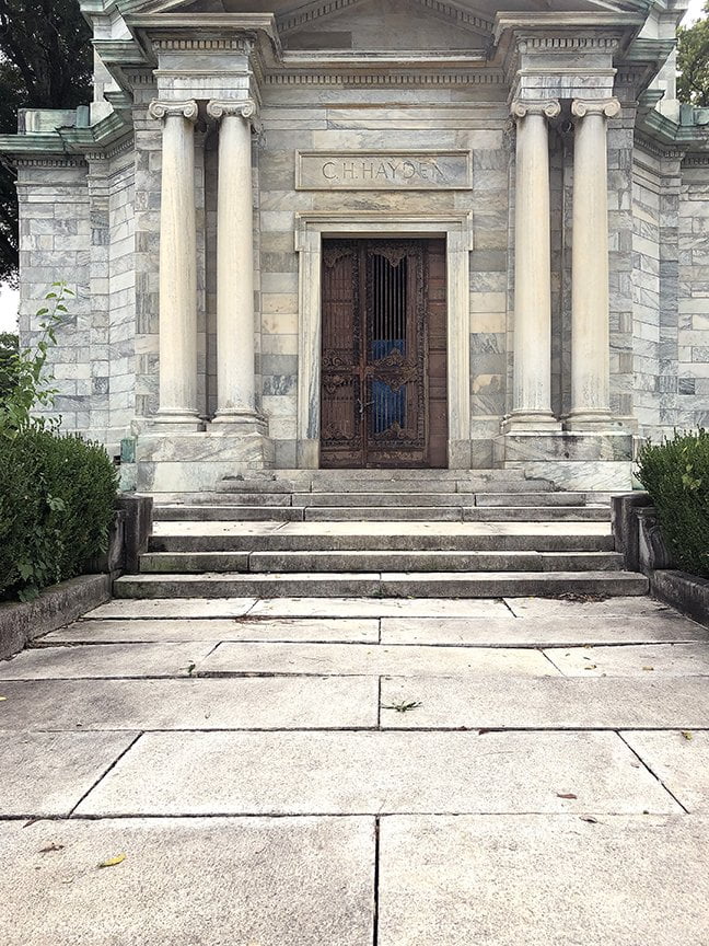 marble entry with dual columns on either side of door