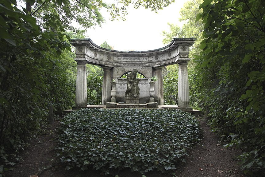 a tomb surrounded by trees in Budapest