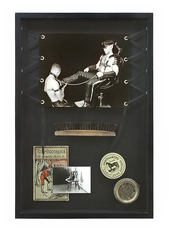 shadow box with image of man with descriptive ephemera