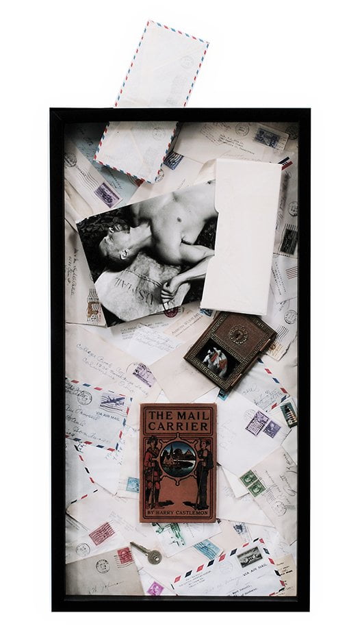 shadow box with image of man with descriptive ephemera