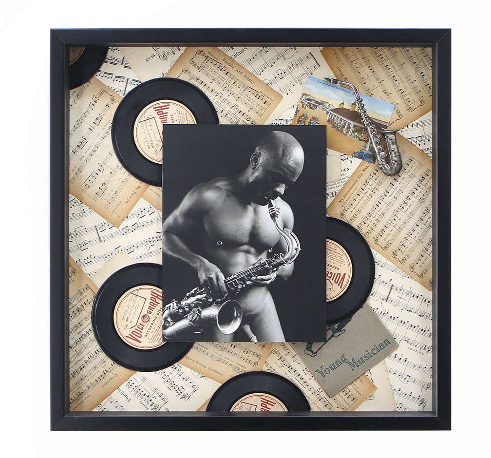 shadow box with image of man with descriptive ephemera