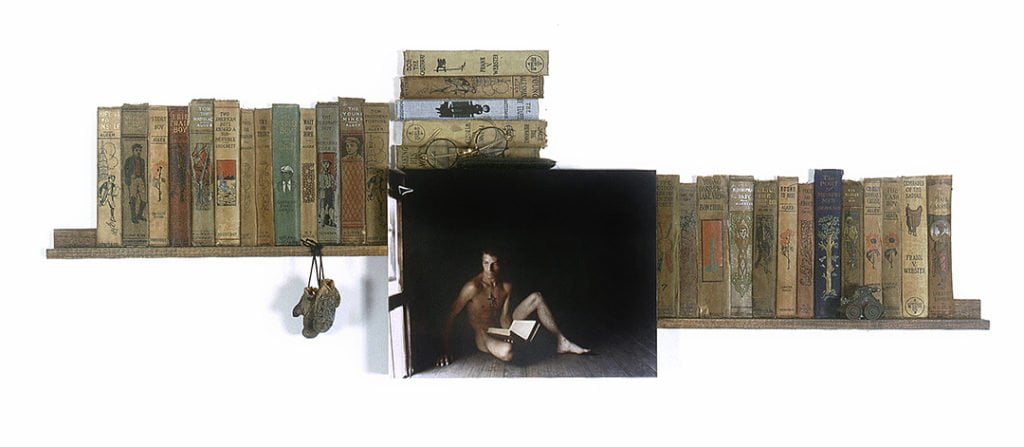 shadow box with image of man with descriptive ephemera