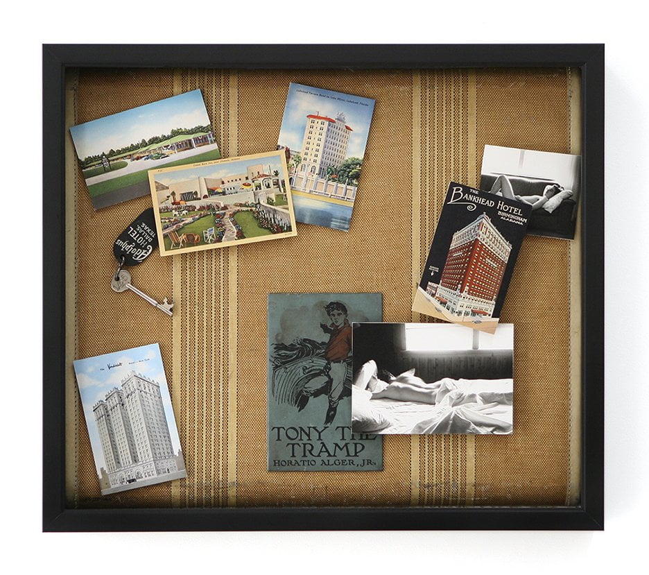 shadow box with image of man with descriptive ephemera