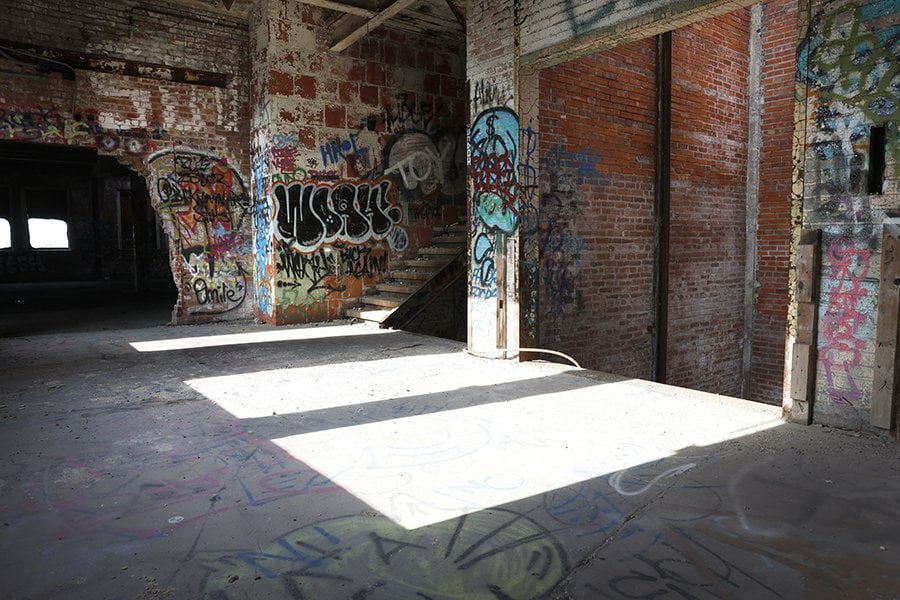 stairs and elevator shaft at old abandoned factory