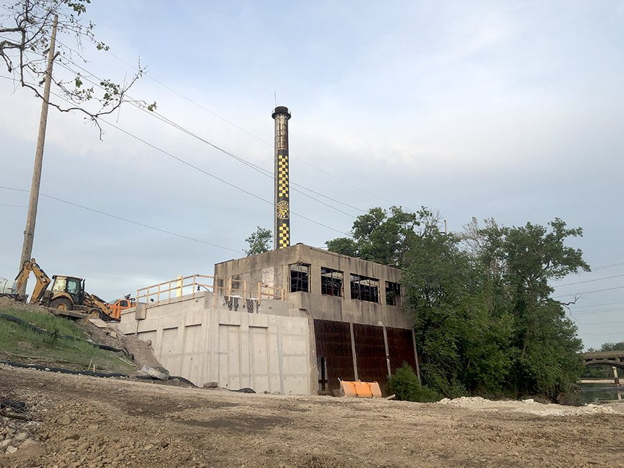 the old pump house from the river with new bridge abutment beside it