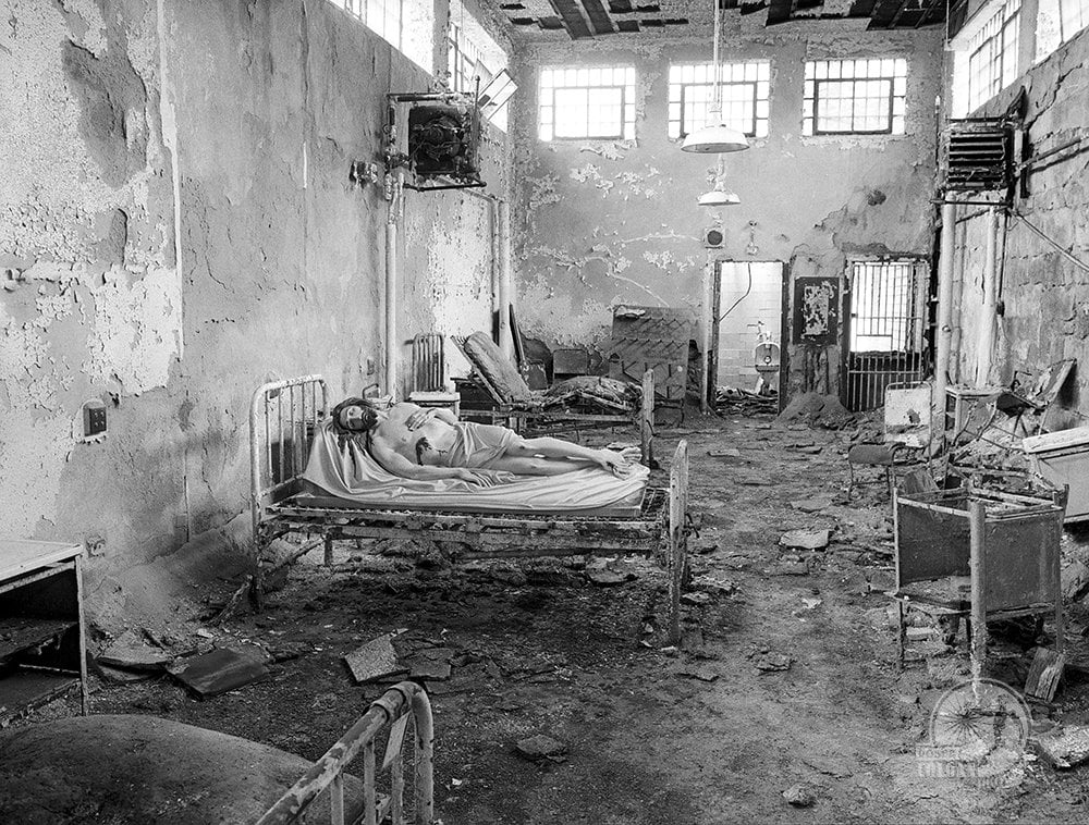statue of Jesus in abandoned prison hospital