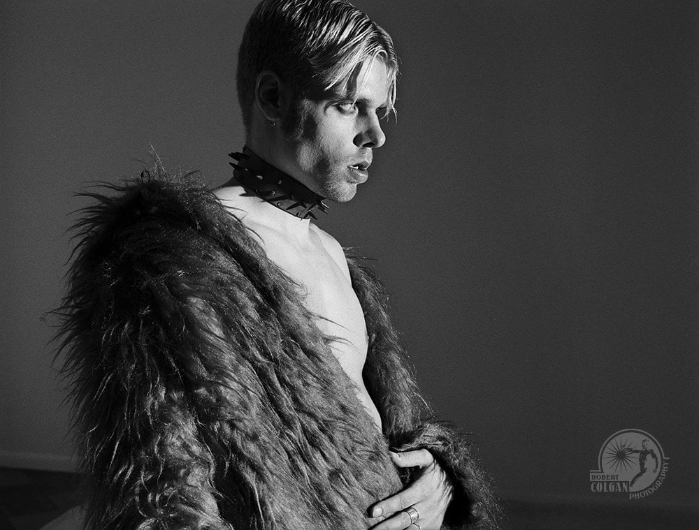 punk man with faux fur coat
