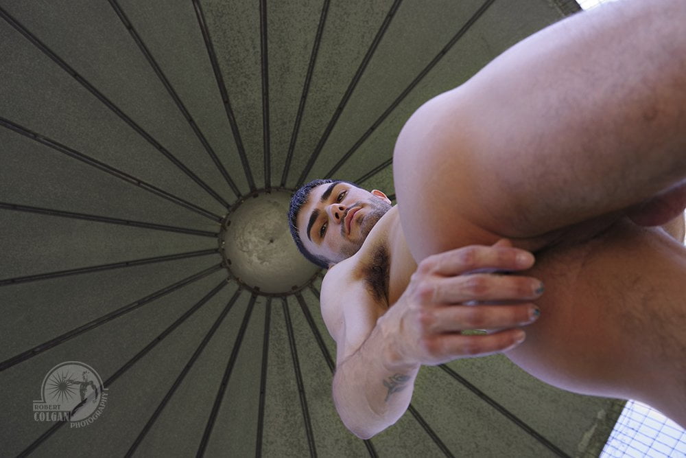 looking up at nude man in silo