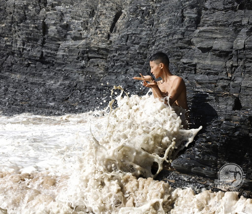 nude man in surf