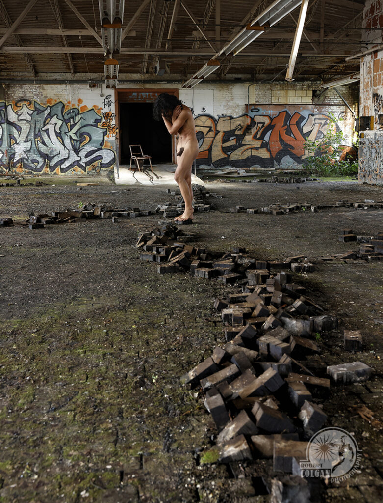 nude man in abandoned building