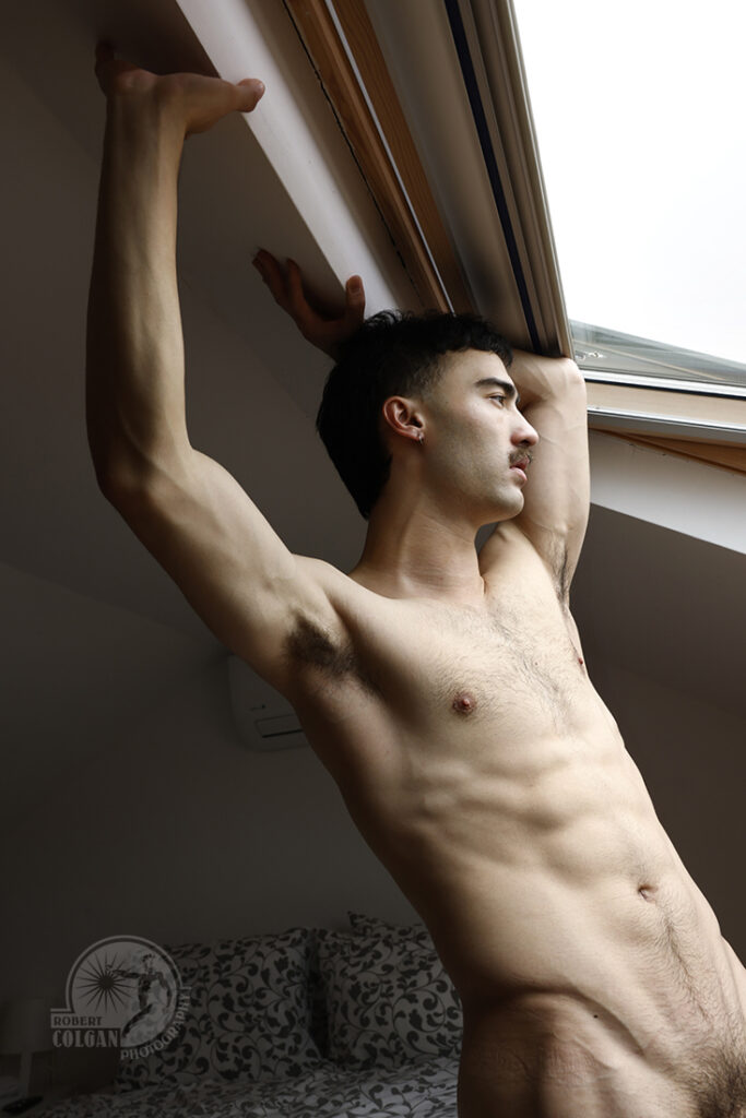 nude man in skylight