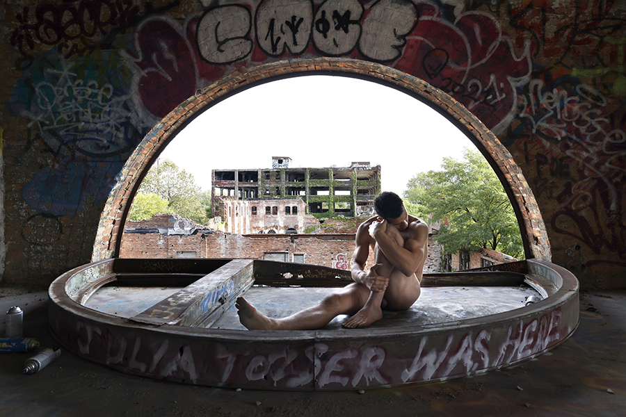 nude man in window arch