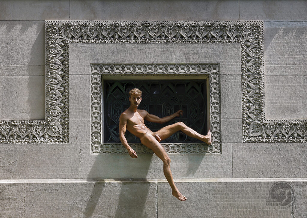 nude man reclining in ornamental window opening of old building
